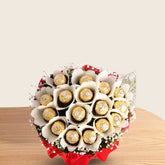 Ferrero Rocher Bunch - Chocolate Bouquet | 16 Piece Pack arranged in red and white paper with green fillers and white ribbon, perfect for gifting.